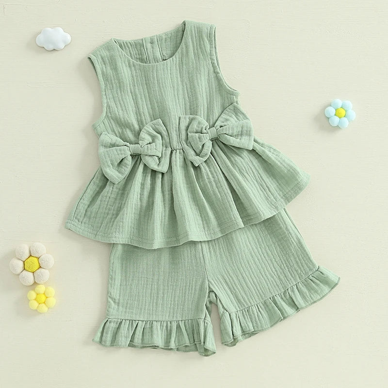 2024-12-24 Lioraitiin Toddler Baby Girl Summer Clothes Solid Color Bow Round Neck Tank Tops + Elastic Waist Ruffled Shorts Set