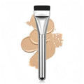 Flat foundation brush with liquid foundation swatch