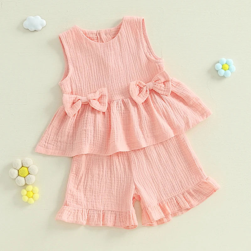 2024-12-24 Lioraitiin Toddler Baby Girl Summer Clothes Solid Color Bow Round Neck Tank Tops + Elastic Waist Ruffled Shorts Set