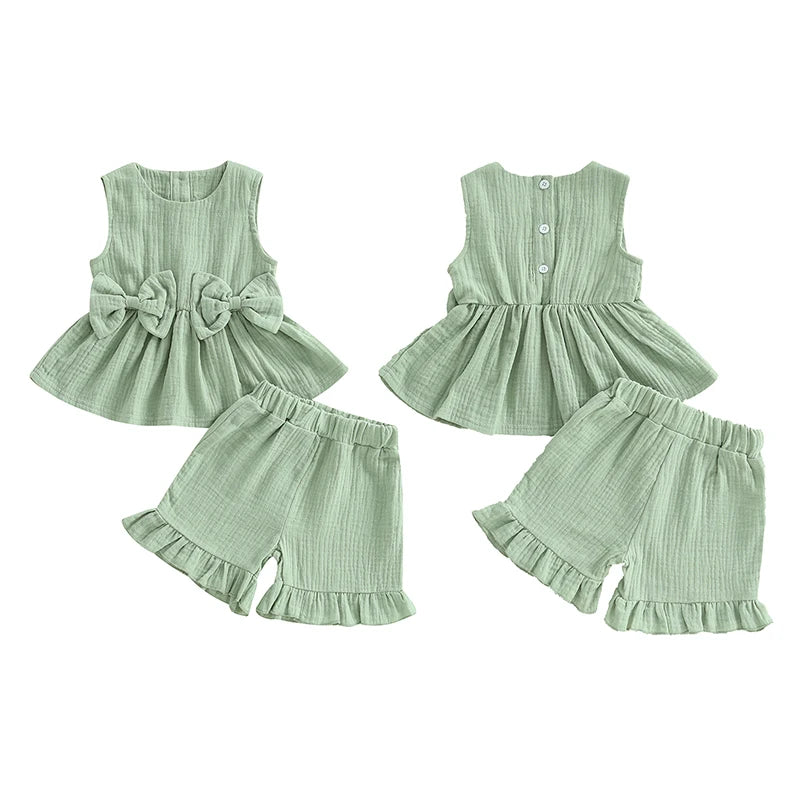 2024-12-24 Lioraitiin Toddler Baby Girl Summer Clothes Solid Color Bow Round Neck Tank Tops + Elastic Waist Ruffled Shorts Set