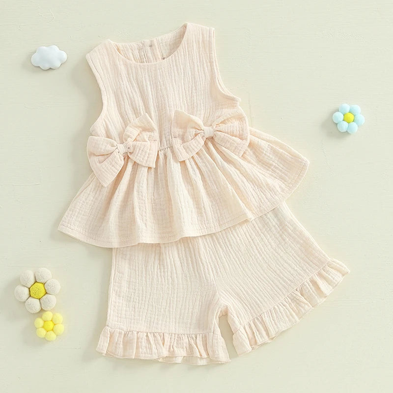 2024-12-24 Lioraitiin Toddler Baby Girl Summer Clothes Solid Color Bow Round Neck Tank Tops + Elastic Waist Ruffled Shorts Set